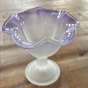 This is a vintage Fenton purple glass compote.